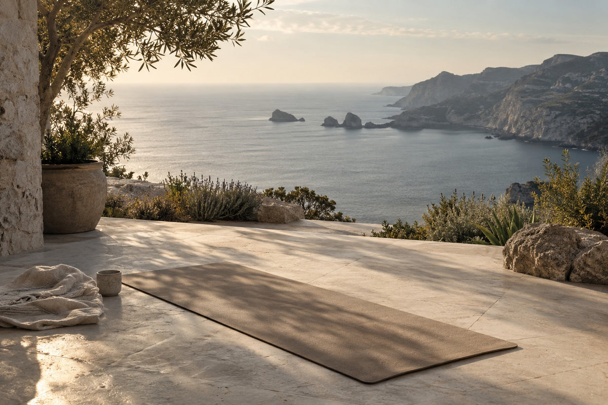 AI-generated coastal terrace with a taupe movement mat overlooking a quiet bay